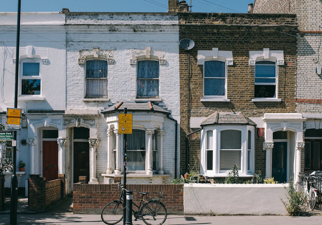 Home Charming vintage brick facades on a typical residential street in London, United Kingdom.